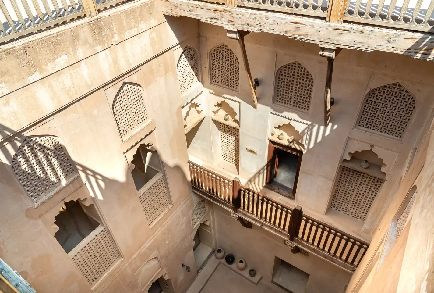 Carved wooden balconies around the inner courtyard of Jabreen Castle