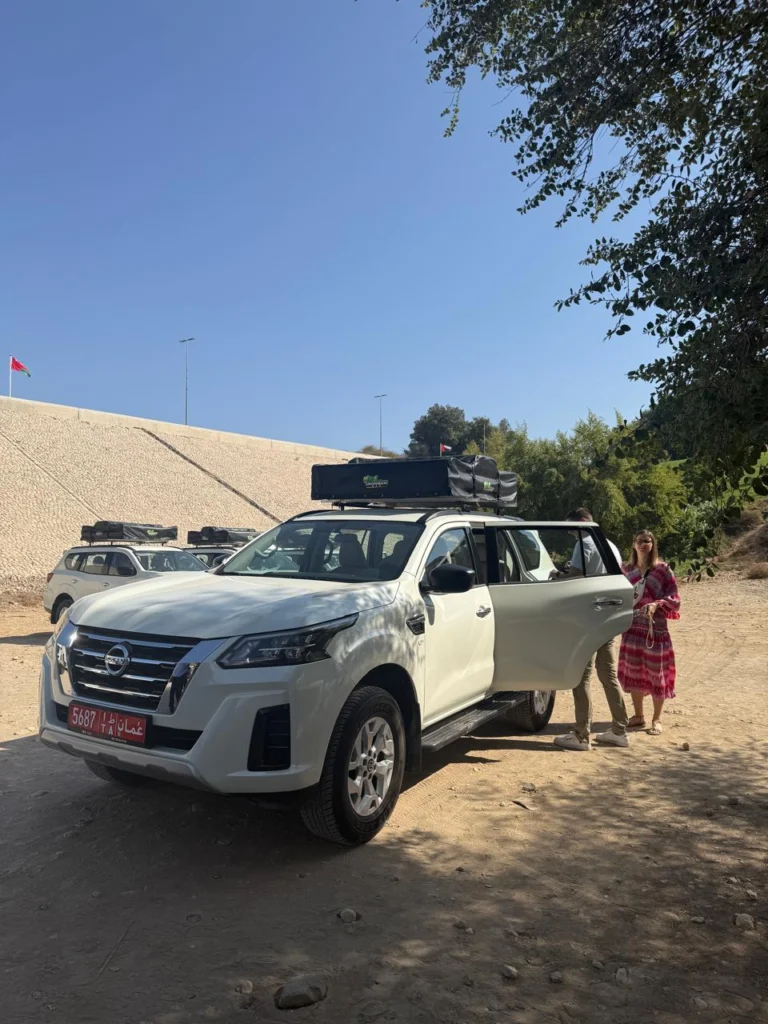 A guest taking delivery of a white fleet 4x4 at the handover point