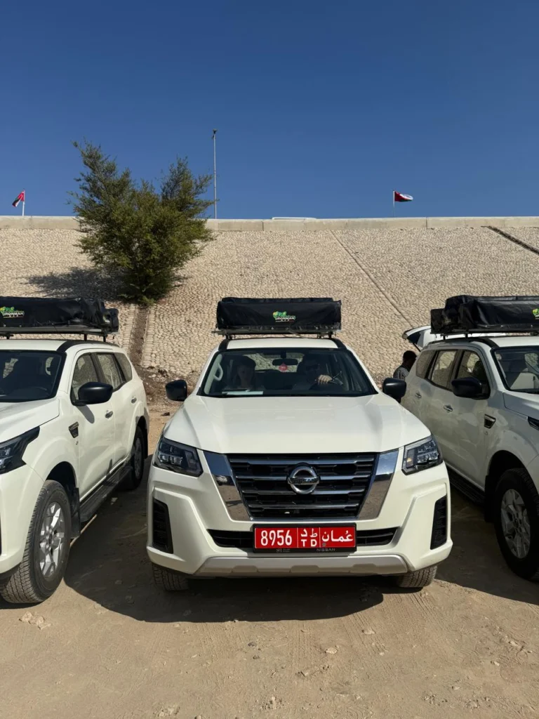 White fleet 4x4s waiting side by side on the lot