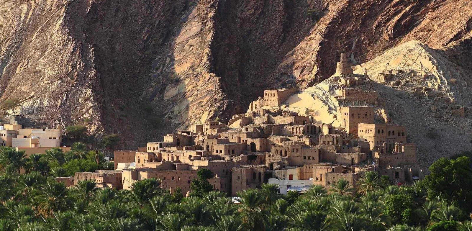 An old stone village below cliffs on Jabal Akhdar