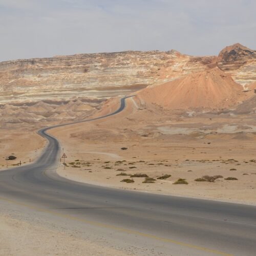 Road winding through desert hills