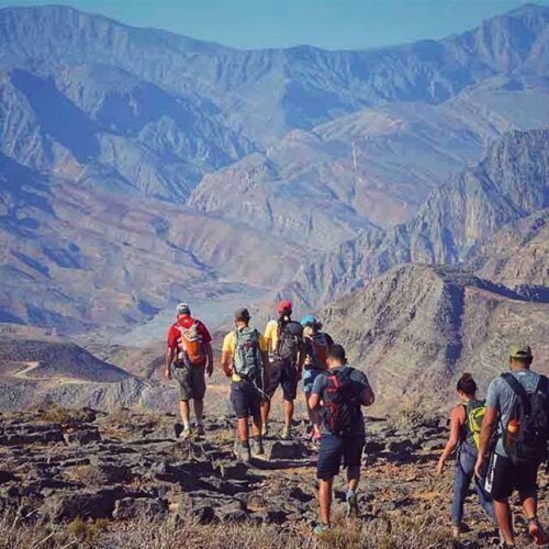 Hikers on a mountain path in Musandam