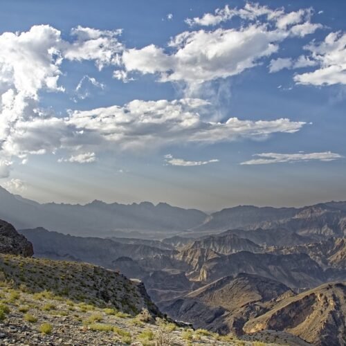 View over mountain ridges and valleys under a cloudy sky