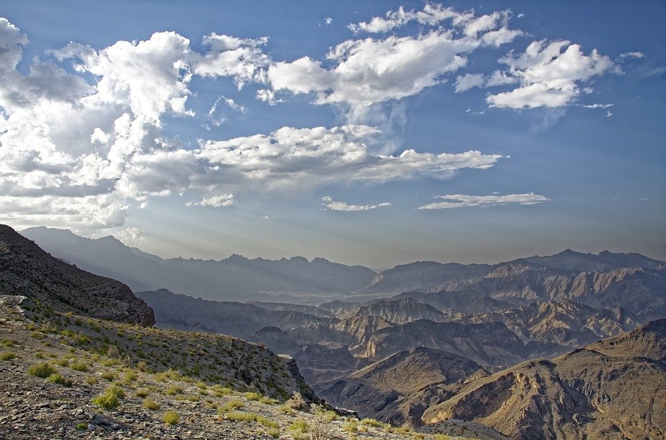 View over mountain ridges and valleys under a cloudy sky